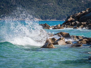 Sea waves splashing on rocks