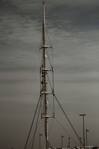 Low angle view of cranes against sky