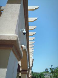 Low angle view of building against clear blue sky