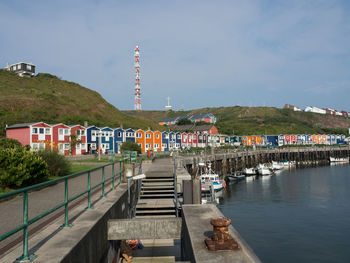 Scenic view of buildings and mountains against sky