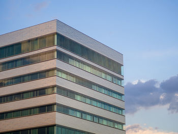 Low angle view of modern building against sky