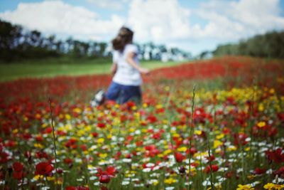 Full length of woman on field against sky