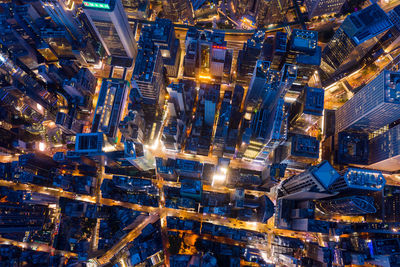 High angle view of illuminated city buildings at night