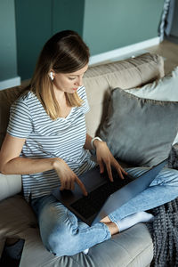 Woman at home using laptop. remote work at home office