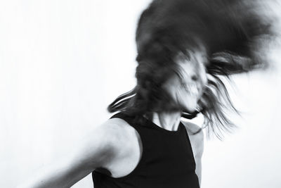 Portrait of woman against white background