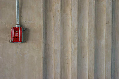 Close-up of telephone booth on wall