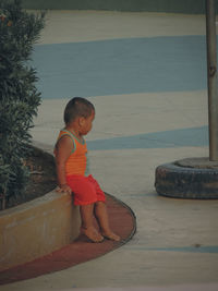 Side view of boy looking at beach