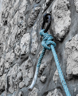 Close-up of rope tied up on rock