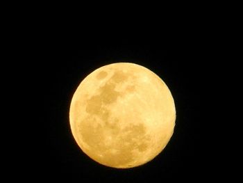 Low angle view of moon against clear sky at night