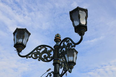 Vintage iron street lamp with blue sky on clear day