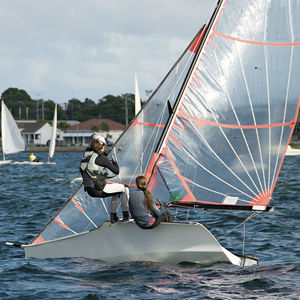 Sailboat in sea against sky