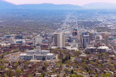 High angle view of buildings in city against sky