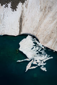 High angle view of ice floating on sea