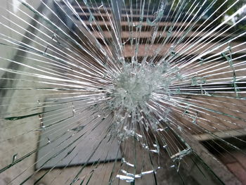 Close-up of broken glass window