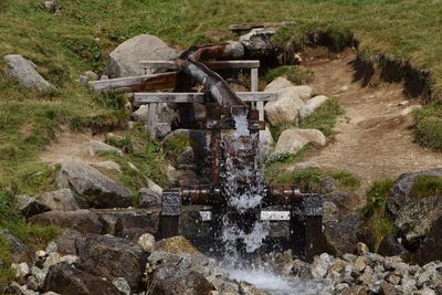 Scenic view of waterfall by river