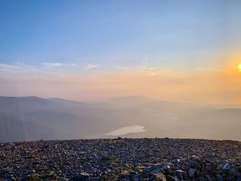 Scenic view of landscape against sky during sunset