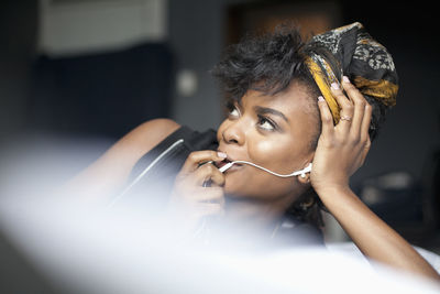 Young woman looking at her laptop