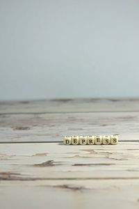 Close-up of coins on table against white background