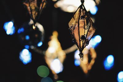 Close-up of illuminated decoration hanging at night