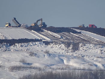 Aerial view of construction site against clear sky during winter