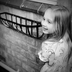 Portrait of smiling girl standing outdoors