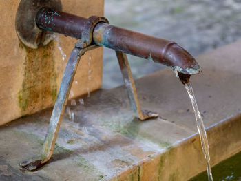 Close-up of water pipe against wall