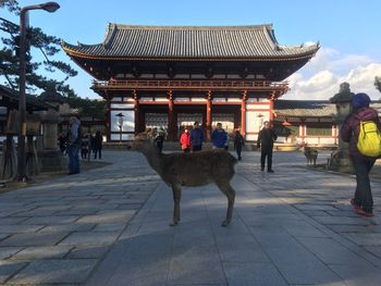 People standing outside temple