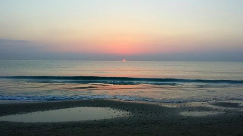 Scenic view of sea at sunset