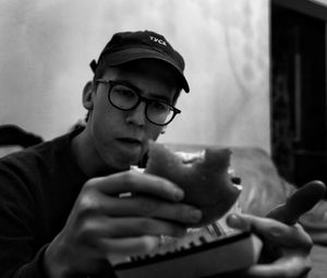 Portrait of young man drinking coffee