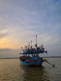 Fishing boat dock at sunset with calm water