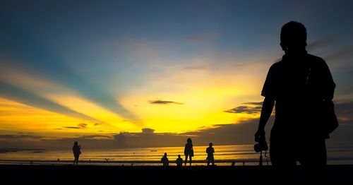 Silhouette of people on beach