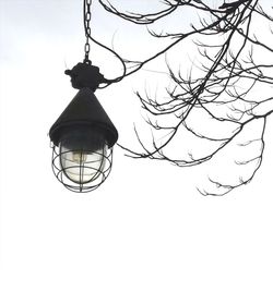 Low angle view of lamp post against sky