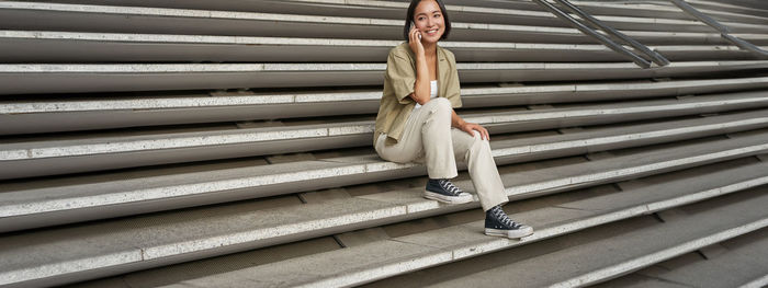 Low section of woman standing on steps