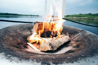 Close-up of food on shore against sky