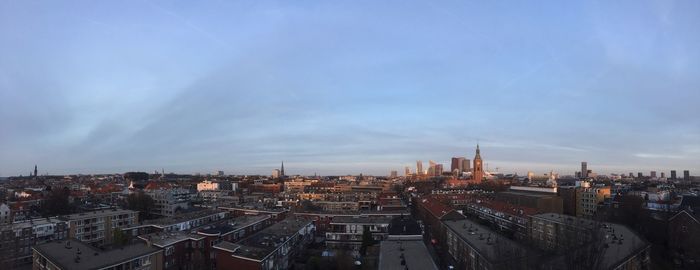 High angle view of city buildings against sky