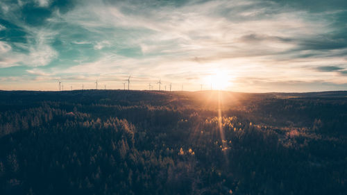 Scenic view of field against sky during sunset