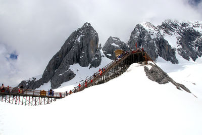 Snow covered mountains against sky