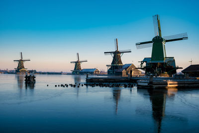 Traditional windmill against clear blue sky