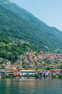 Old italian city against mountain in summer