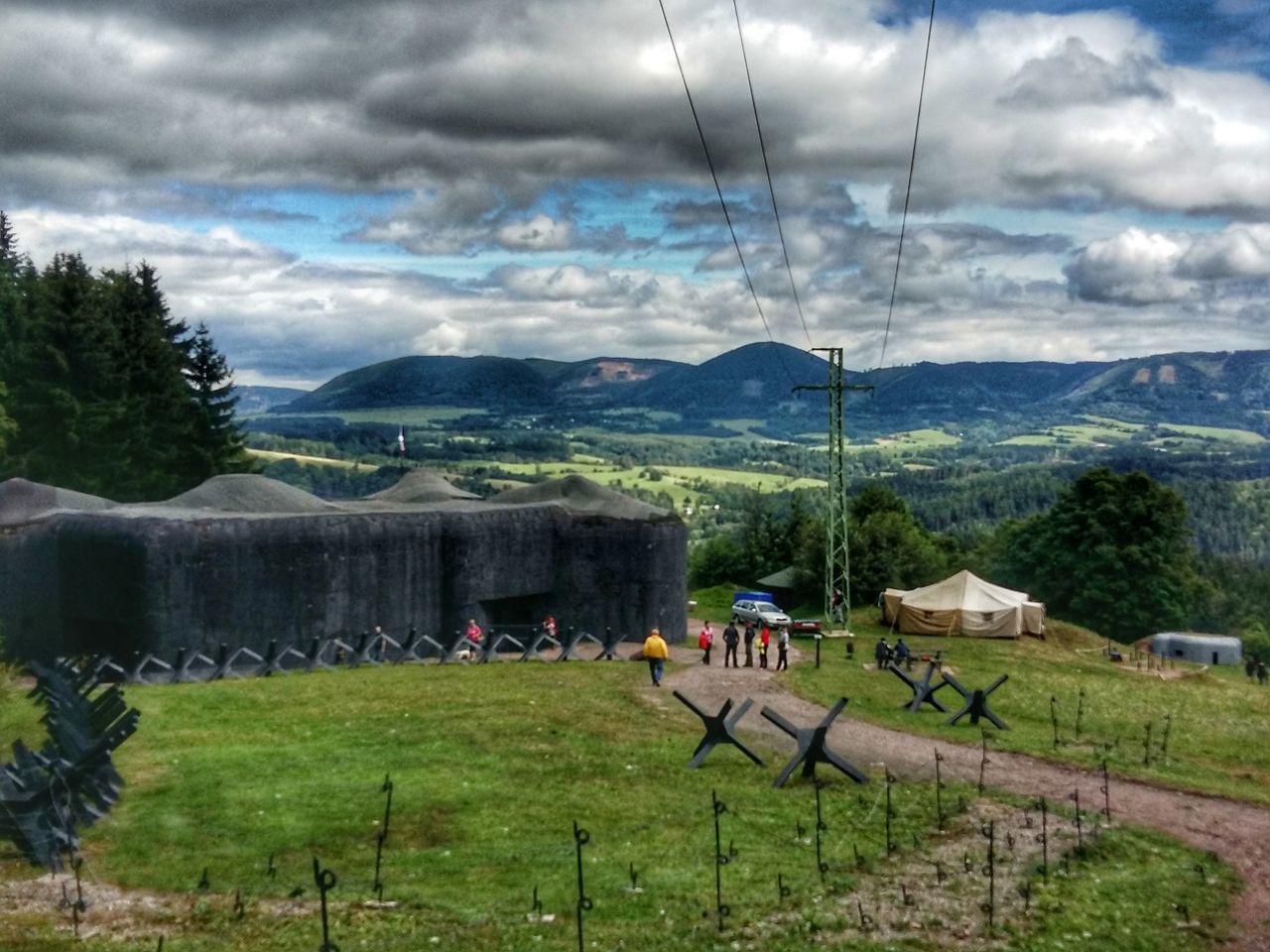 BUILT STRUCTURE ON LANDSCAPE AGAINST SKY