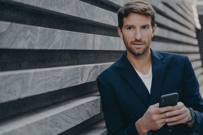 Portrait of man using mobile phone