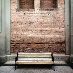 Built structure against brick wall
