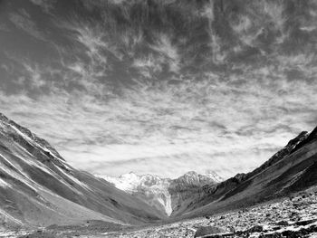 Scenic view of snow covered mountains against sky