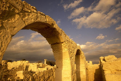 Panoramic view of old ruins against cloudy sky