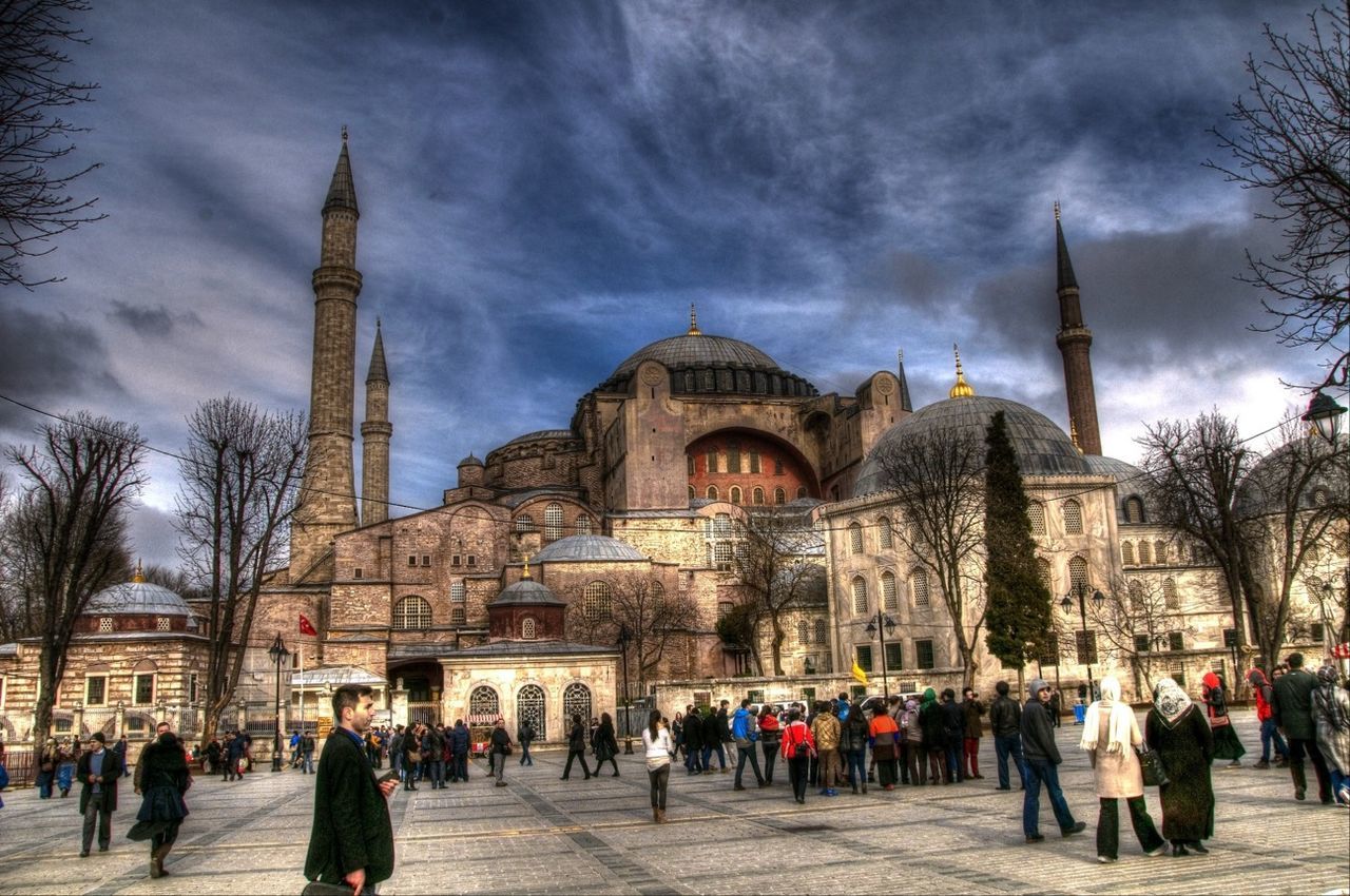 architecture, large group of people, built structure, building exterior, famous place, tourism, travel destinations, place of worship, religion, sky, international landmark, person, travel, spirituality, tourist, church, cloud - sky, men