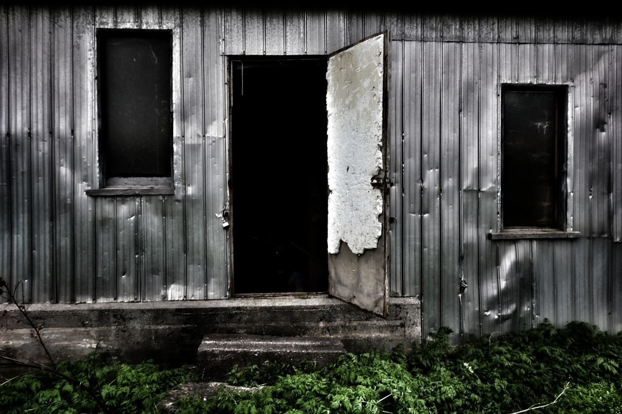 CLOSED DOOR OF OLD HOUSE