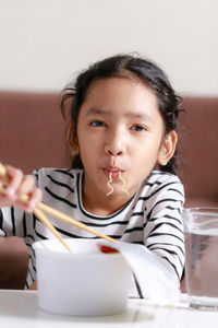 Portrait of girl having food