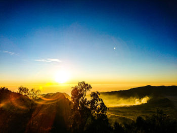 Scenic view of landscape against sky during sunset