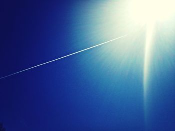 Low angle view of vapor trails in sky