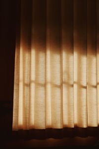 Full frame shot of curtain against window at home